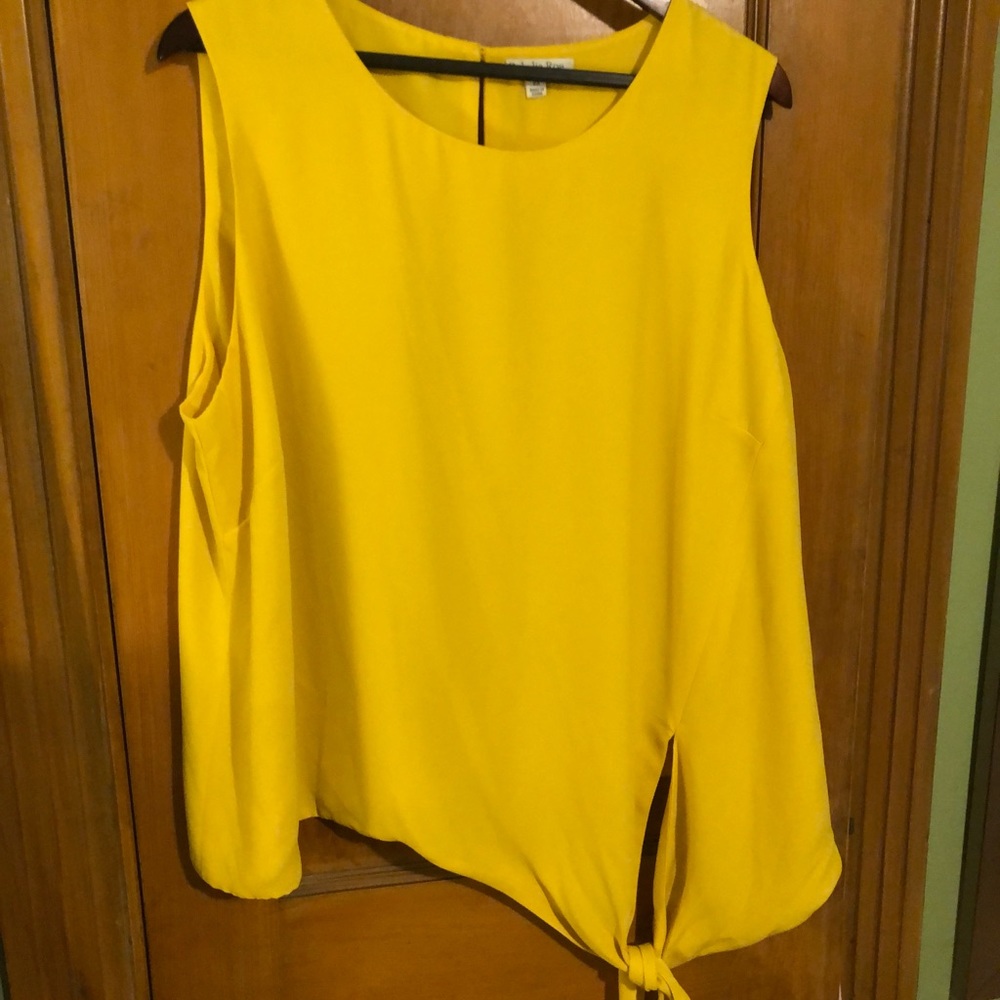 Bright yellow front tie sleeveless blouse.